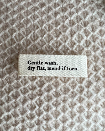 PetiteKnit - "Gentle wash, dry flat, mend if torn." -label